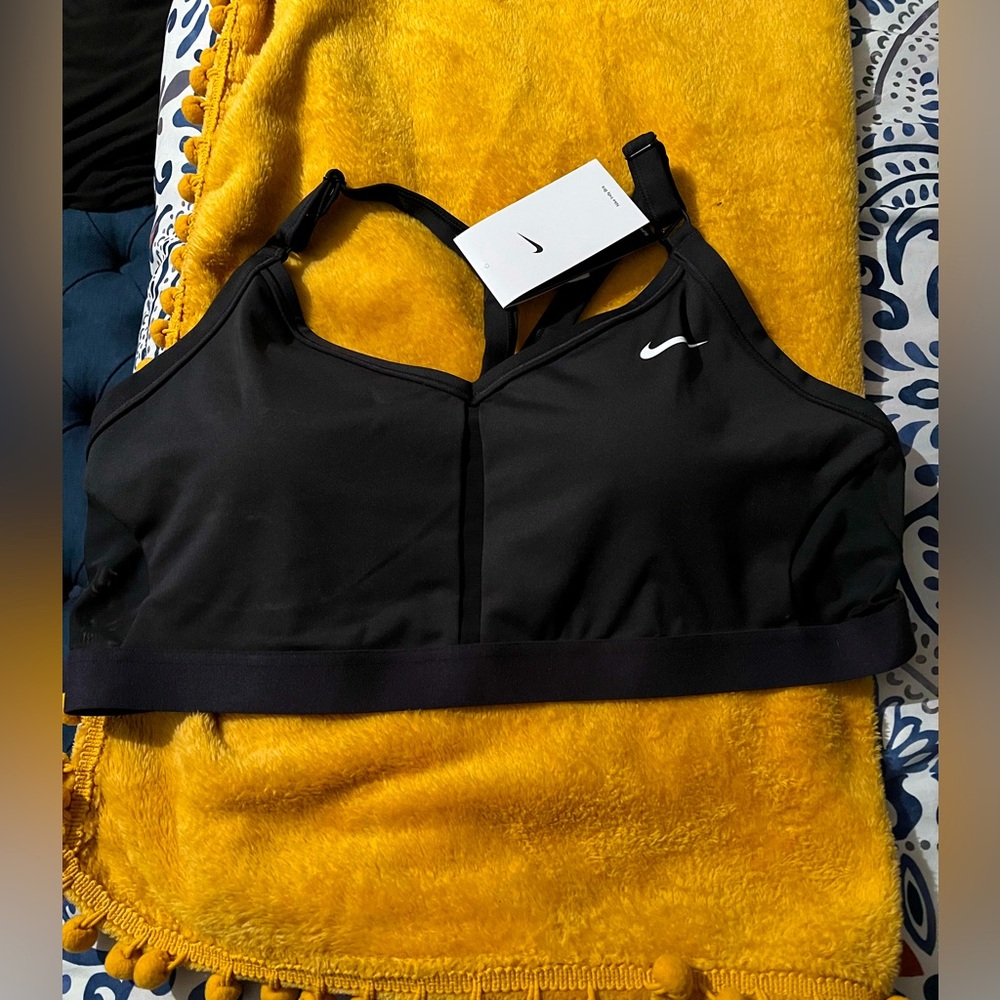 Nike sports bra SZ XL/1X in black with white check mark. NWT. Asking $25
